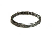 Lot 29 - A channel set eight cut eternity ring