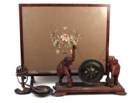 Lot 427A - A late 19th century brass table gong on elephant supports