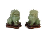 Lot 168 - A pair of Chinese jadeite seated lions