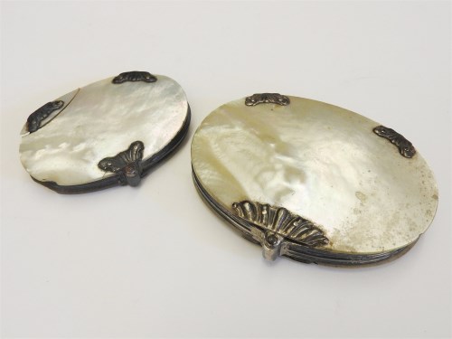 Lot 135 - A mother of pearl cased magnifying glass