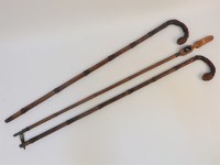 Lot 347A - A pair of walking sticks