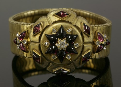 Lot 54 - A late Victorian gold diamond and garnet bracelet