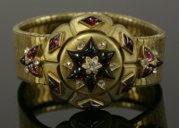 Lot 54 - A late Victorian gold diamond and garnet bracelet