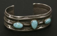 Lot 57 - A Native American Indian turquoise and silver torque style cuff bangle possible circa 1920