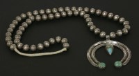 Lot 58 - A Native American Indian Navajo silver and turquoise Naja necklace