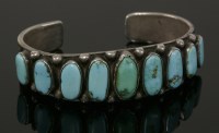 Lot 60 - A Native American Indian turquoise set silver torque bangle