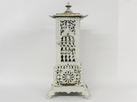 Lot 413 - A Victorian cast iron white enamelled stove