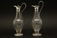 Lot 116 - A pair of small Georgian silver topped ewers