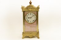 Lot 173 - A gilt metal and ceramic panel mantle clock