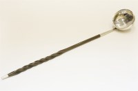 Lot 121 - A Georgian whale bone handled Scottish silver toddy ladle