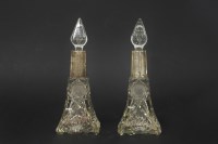 Lot 110 - A pair of silver topped perfume bottles