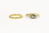 Lot 21 - A gold three stone diamond crossover ring