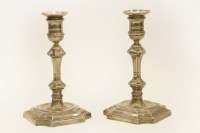 Lot 124 - A pair of silver candlesticks