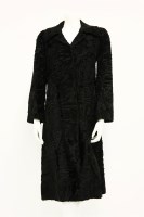 Lot 1387 - A black astrakhan or seal fur mid-length coat