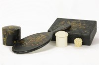 Lot 67 - A Chinese lacquer hand mirror