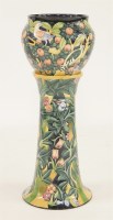 Lot 639 - A Moorcroft pottery 'Bark Thief' jardinière and stand