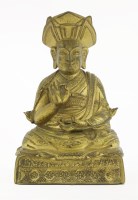 Lot 143 - A gilt bronze Tibetan figure
