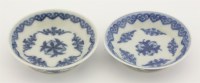 Lot 43 - Two small blue and white saucers