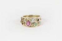 Lot 5 - A gold rub set coloured gem stone and diamond tapering band ring