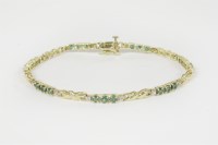 Lot 16 - A gold emerald line bracelet