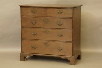 Lot 461 - A George III oak chest of drawers