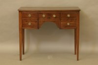 Lot 594 - A George III inlaid mahogany kneehole desk