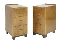 Lot 220 - A pair of Art Deco walnut three-drawer bedside chairs