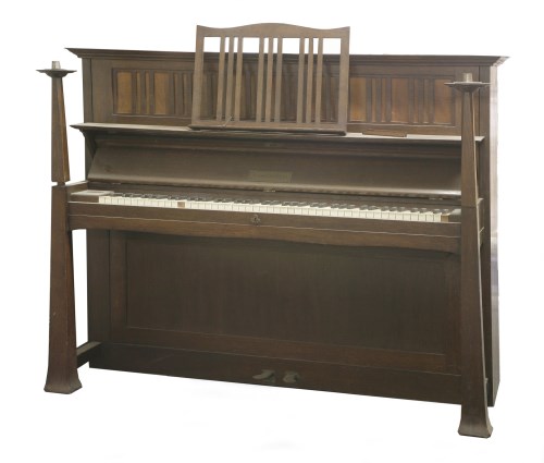 Lot 34 - An Arts & Crafts oak upright piano
