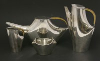 Lot 520 - A Christofle four-piece 'Como' silver-plated tea set