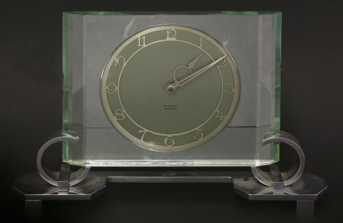 Lot 234 - An Art Deco green glass and chrome mantel clock