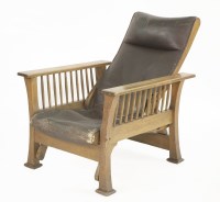 Lot 142 - An oak reclining armchair
