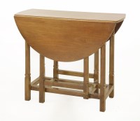 Lot 58 - A walnut gateleg table
