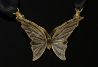 Lot 107 - A French Art Nouveau carved horn butterfly pendant