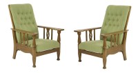 Lot 145 - A pair of Arts and Crafts oak reclining armchairs