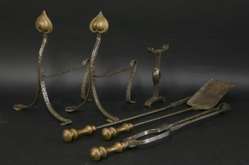 Lot 100 - A set of Arts and Crafts wrought iron fire tools