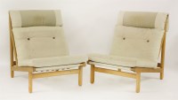 Lot 417 - A pair of oak lounge chairs