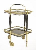 Lot 616 - A brass two-tier drinks trolley