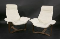 Lot 660 - A pair of cream leather loungers