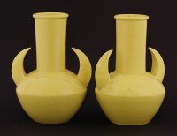 Lot 103 - A pair of yellow-glazed vases