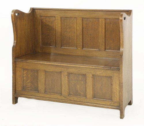 Lot 134 - An Arts & Crafts oak hall bench