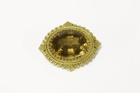 Lot 13 - A gold oval mixed cut citrine brooch