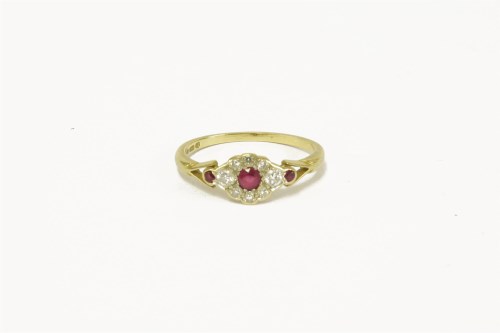 Lot 20 - An 18ct gold ruby and diamond cluster ring