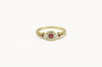 Lot 20 - An 18ct gold ruby and diamond cluster ring