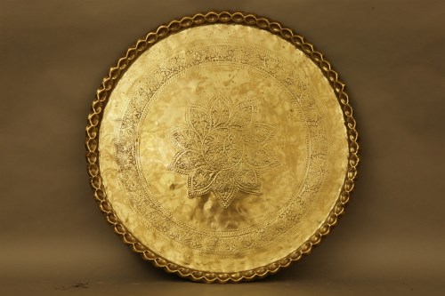 Lot 401 - A large Eastern brass tray
