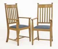 Lot 41 - A pair of Arts and Crafts oak armchairs