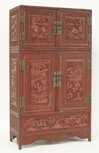 Lot 194 - A cinnabar lacquered cabinet