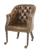 Lot 597 - A leather button-back desk chair