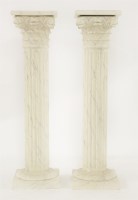 Lot 660 - A pair of Cornithian column simulated marble pedestals