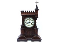 Lot 484 - An oak mantel clock in the form of a castle