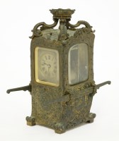 Lot 483 - A bronze sedan chair carriage clock